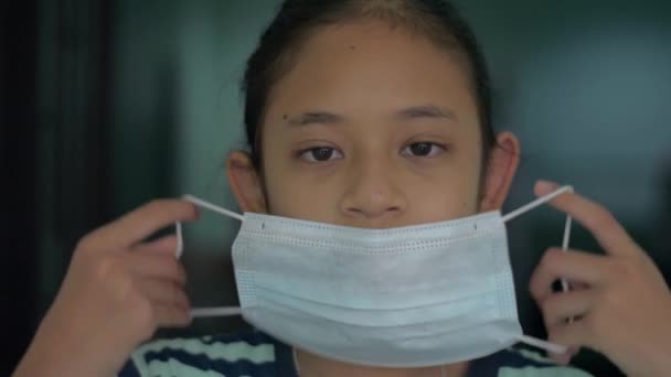 Portrait Adorable Asian Girl Putting Protective Mask Coronavirus Second Outbreak — Stock Video