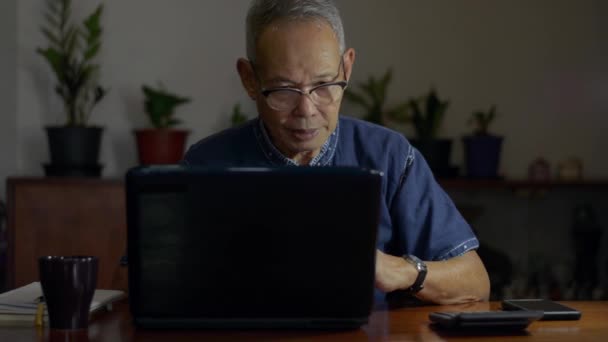 Elderly Freelance Male Writer Wears Eyeglasses Typing Laptop Drinking Hot — Stock Video