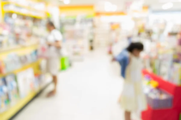 Blurred people in the book store — Stock Photo, Image