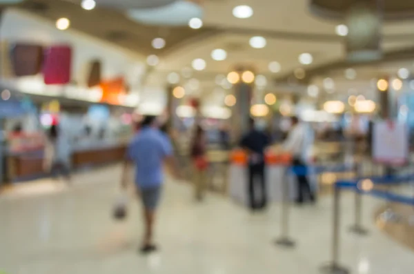 Blurred people walking in the food court