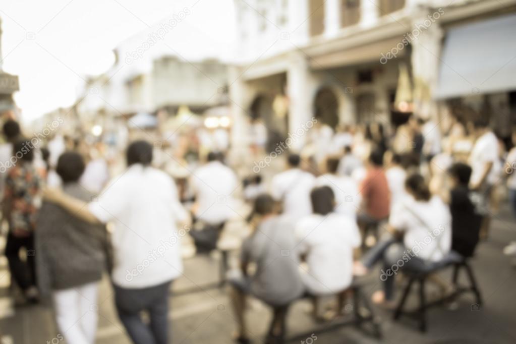 Blurred people watching a performance on the street, Phuket, Tha