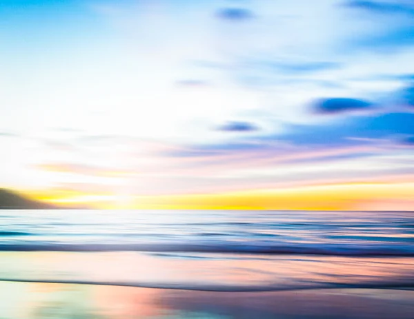 An abstract seascape with blurred panning motion on paper backgr