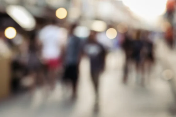 Blurred people walking on the street — Stock Photo, Image