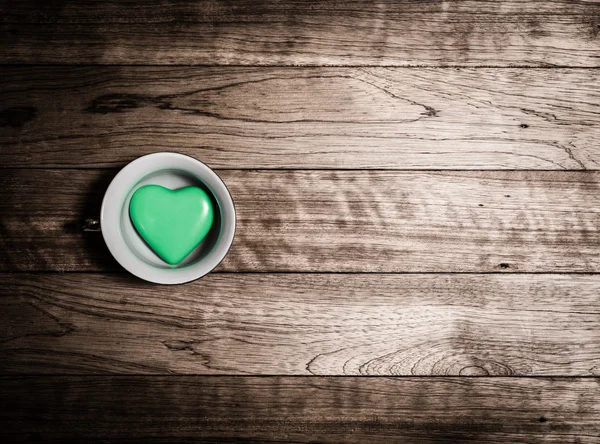 Green heart ceramic in coffee cup