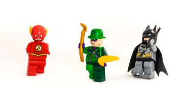 ZAGREB, CROATIA - DECEMBER 25, 2015: Lego toys Batman, Riddler and Flash from DC universe. Studio shot on white background. clipart