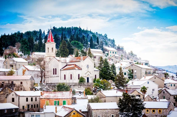 Small Mediterranean town on the slopes of hill with a church on top — Stock Photo, Image