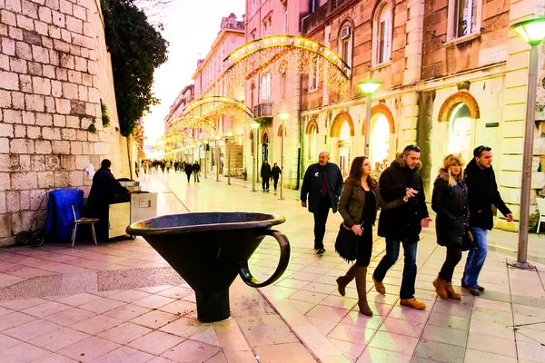 Tourists and citizens walking along one of the main streets in the old town of Split, Croatia — Stock Photo, Image