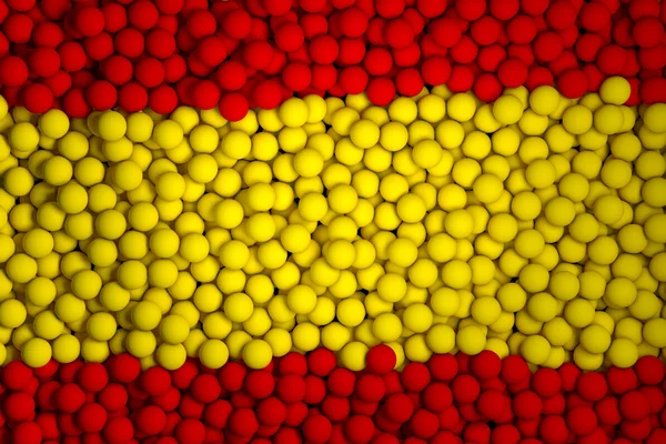 Muchas pequeñas bolas de colores que forman la bandera nacional de España —  Fotos de Stock