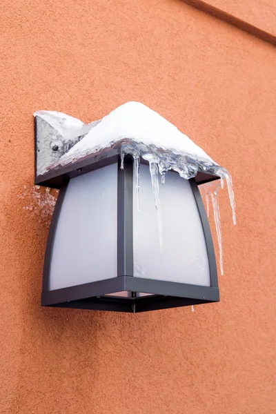 Frozen lamp post on house wall — Stock Photo, Image