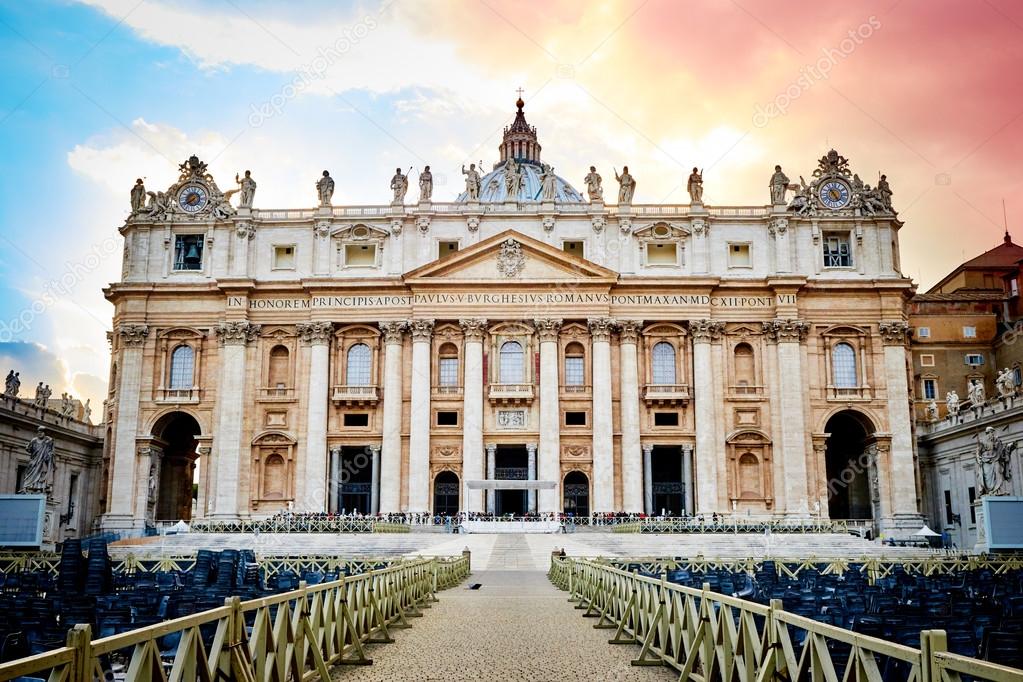 Dramatic sunset over facade of the basilica of St. Peter's in the Vatican, Rome, Italy