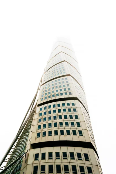 MALMO, SWEDEN - DECEMBER 31, 2014: Turning torso skyscraper, symbol of city Malmo, on foggy and cloudy day in Sweden. — Stock Photo, Image