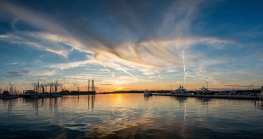 Breathtaking sunset over the harbor of Pula, Istria, Croatia