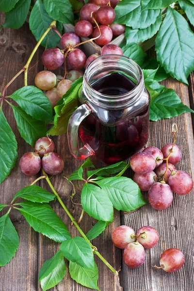 Fresh grape  on wooden board — Stock Photo, Image