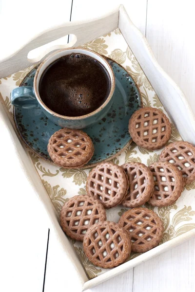 Chocolate cookies and cup of aromatic coffee — Stock Photo, Image
