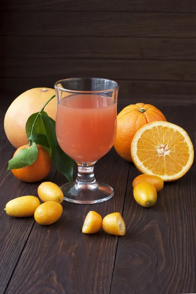 Fresh fruit juices on wooden table — Stock Photo, Image