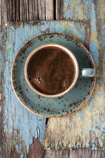 Xícara de café no fundo de madeira — Fotografia de Stock