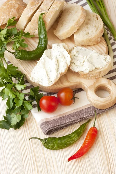 Freshly baked traditional ciabatta bread on wooden board — Stock Photo, Image