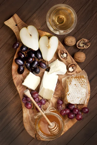 Cheese, grape and wine glass — Stock Photo, Image