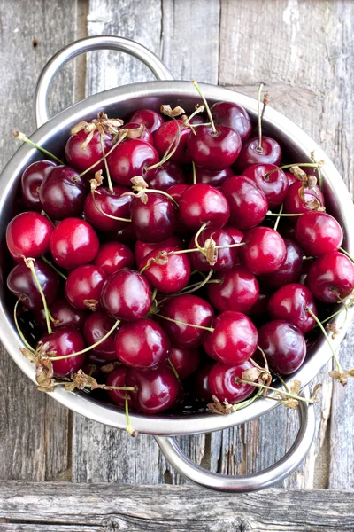 Cherries on wooden table — Stock Photo, Image