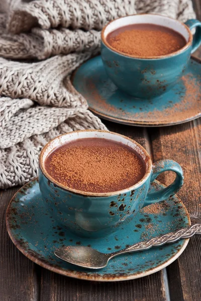 Mug with hot chocolate  on wooden table — Stock Photo, Image