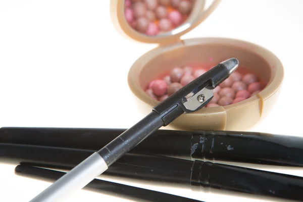 Blush in the balls and make-up brushes close-up — Stock Photo, Image