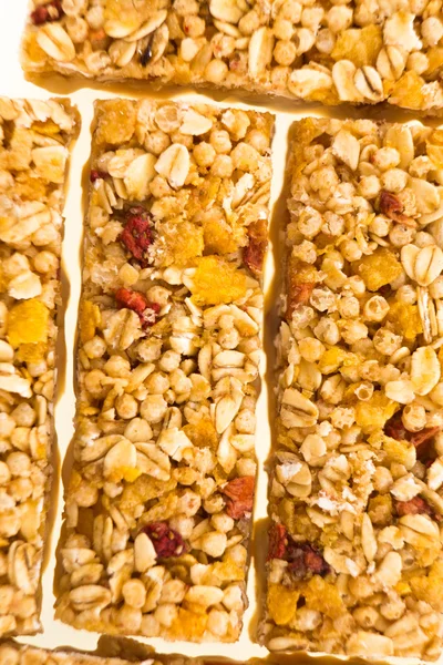 Muesli bars with  dried fruit on isolated background — Stock Photo, Image