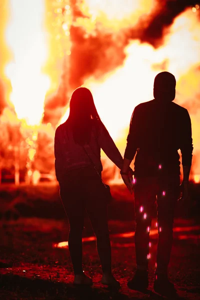 Beautiful couple on a background of fireworks — Stock Photo, Image