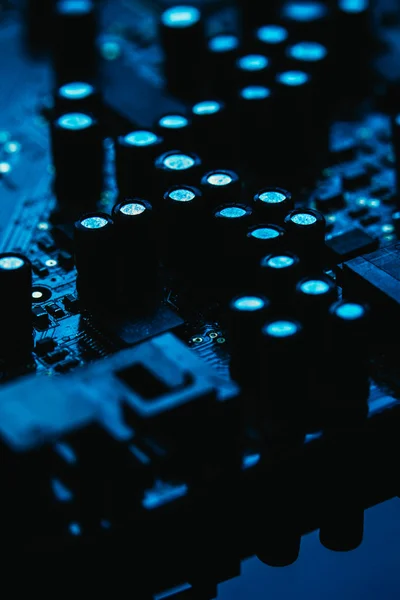 Computer motherboard closeup blue color on dark background — Stock Photo, Image