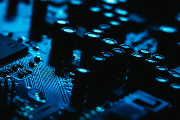 Computer motherboard closeup blue color on dark background — Stock Photo, Image