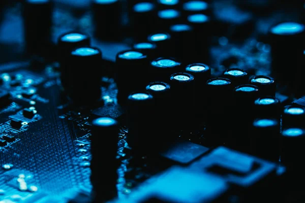 Computer motherboard closeup blue color on dark background — Stock Photo, Image