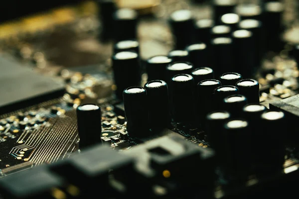 Computer motherboard closeup yellow gray color on dark background — Stock Photo, Image