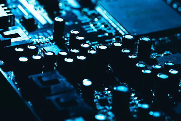 Computer motherboard in blue dark background close-up — Stock Photo, Image