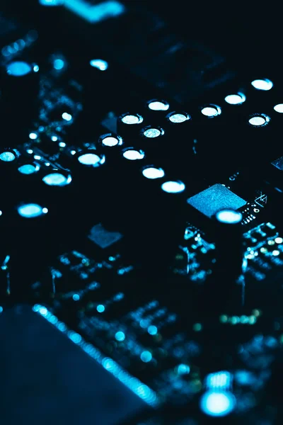 Computer motherboard in blue dark background close-up Stock Picture