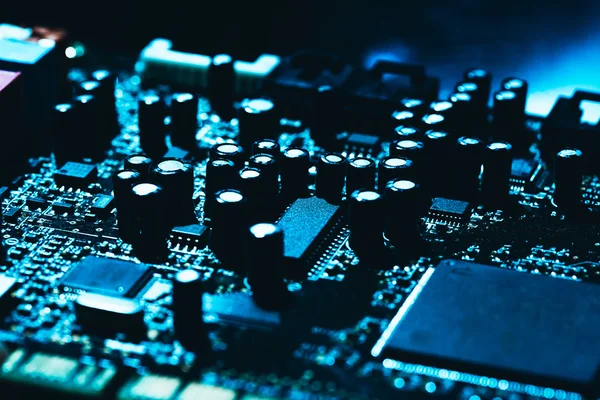 Computer motherboard in blue dark background close-up Royalty Free Stock Images