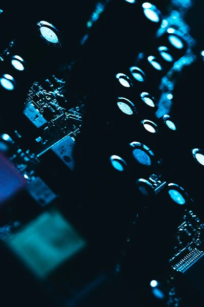 Computer motherboard in blue dark background close-up — Stock Photo, Image