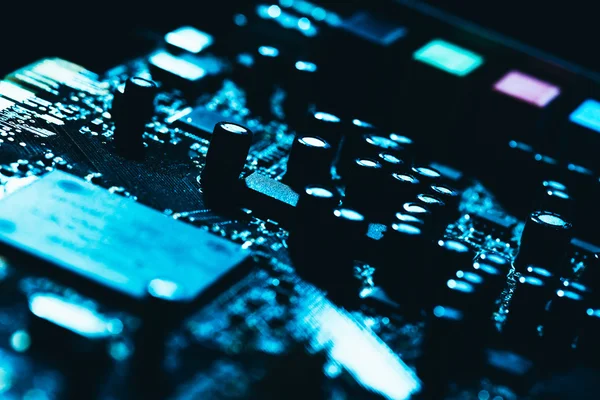 Computer motherboard in blue dark background close-up — Stock Photo, Image