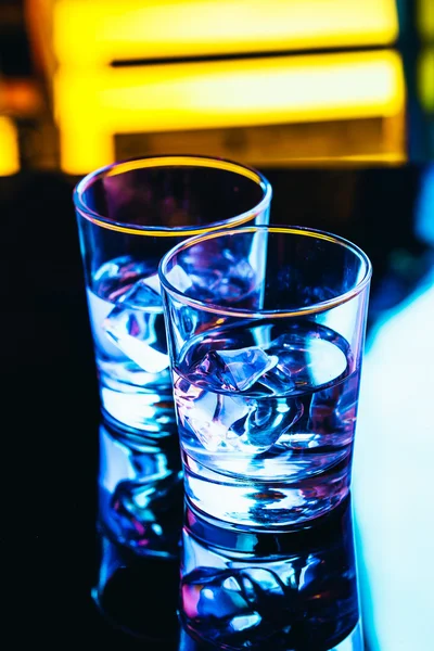 Drinking glasses close-up on a dark background — Stock Photo, Image