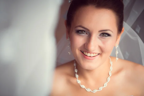 Happy Bride looking in window — Stock Photo, Image