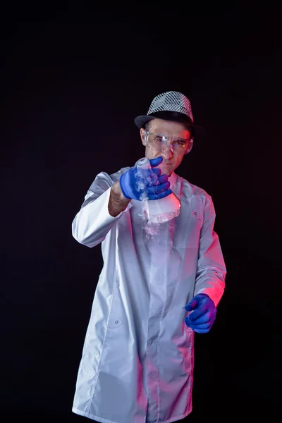Smiling man scientist with dry ice — Stock Photo, Image