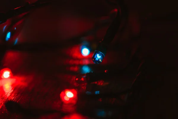 Christmas lights on wooden background. Selective focus — Stock Photo, Image