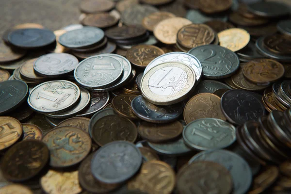 One euro coin on russian roubles coins — Stock Photo, Image