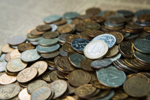 One euro coin on russian roubles coins — Stock Photo, Image