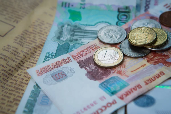 Russian roubles banknotes and euro and dollars coins — Stock Photo, Image