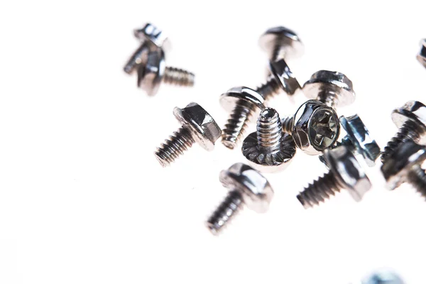 Computer screws against white background — Stock Photo, Image