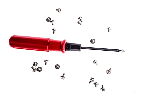 Isolated shot of red handle screwdriver and screws — Stock Photo, Image