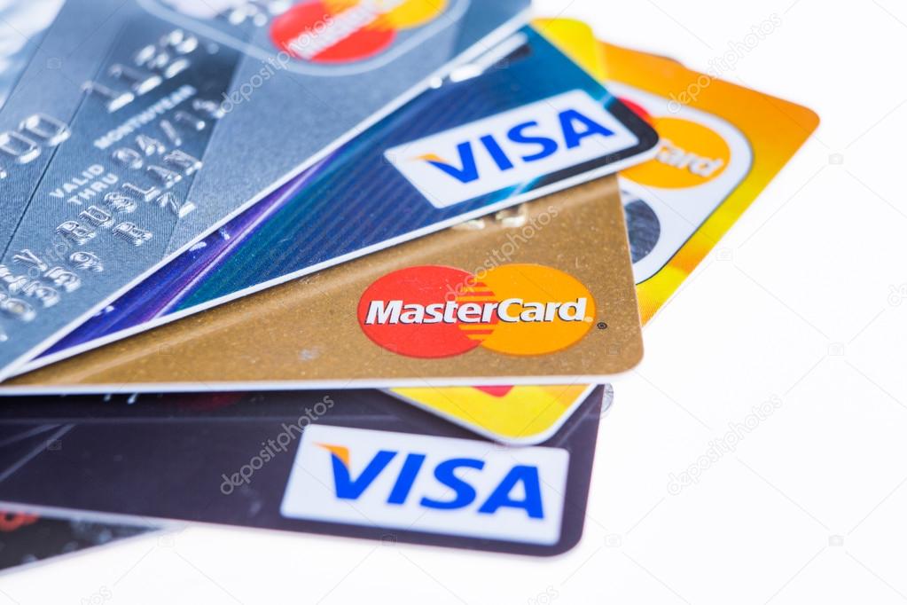 Samara, Russia- 3 February 2015: Closeup studio shot of credit cards issued by the three major brands American Express, VISA and MasterCard.