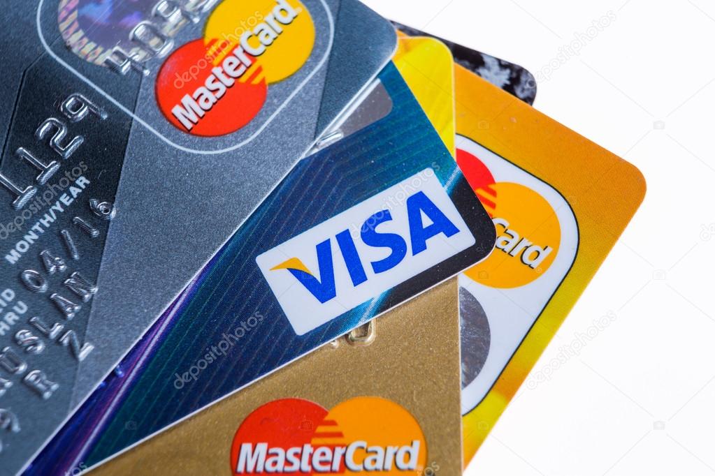 Samara, Russia- 3 February 2015: Closeup studio shot of credit cards issued by the three major brands American Express, VISA and MasterCard.