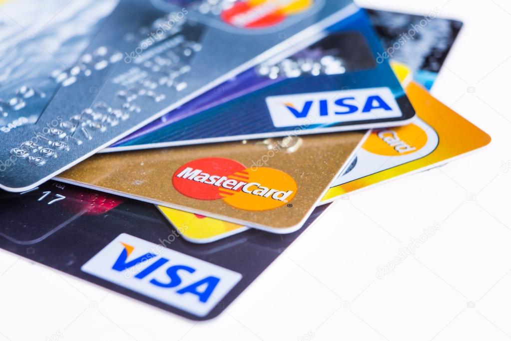 Samara, Russia- 3 February 2015: Closeup studio shot of credit cards issued by the three major brands American Express, VISA and MasterCard.