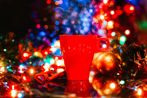 A cup of cacao with christmas lights — Stock Photo, Image