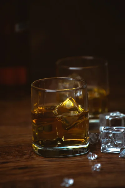 Shot of whiskey on old wooden surface — Stock Photo, Image